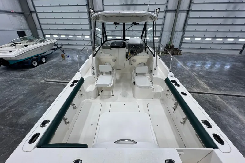 Slide: The Image of 2006 Trophy 2352 WA boat interior in a spacious garage setting. - 8