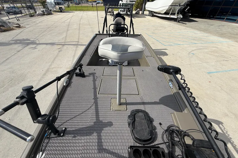 Slide: The Image of 2022 Gator Tail Extreme 1860cc boat interior with fishing seat and equipment. - 13
