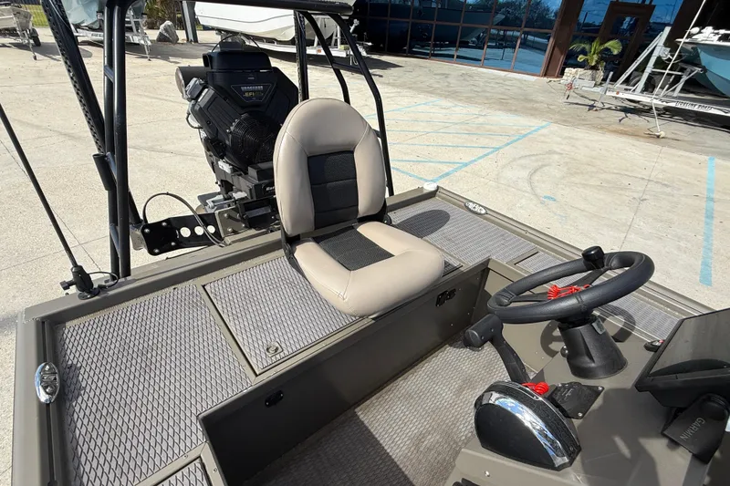 Slide: The Image of 2022 Gator Tail Extreme 1860cc boat interior with steering wheel and seat. - 16