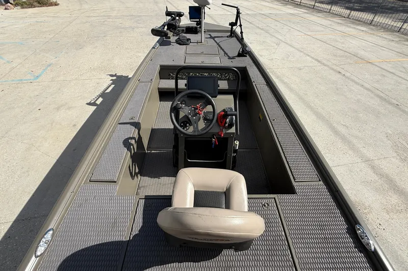 Slide: The Image of 2022 Gator Tail Extreme 1860cc boat interior with steering console and seating. - 8
