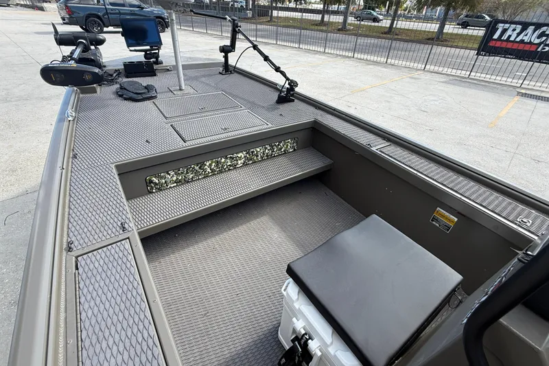 Slide: The Image of 2022 Gator Tail Extreme 1860cc boat interior with fishing equipment and seating. - 9