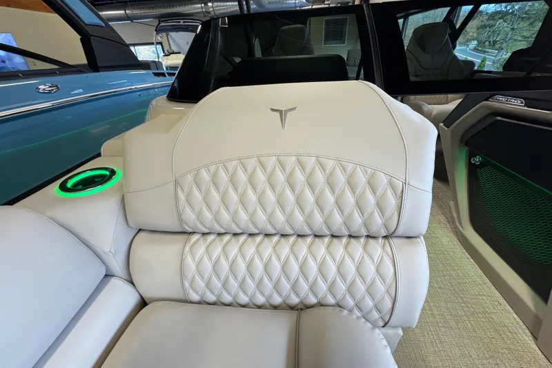 Slide: The Image of Luxurious interior of 2026 Tahoe Pontoon Grand Tahoe LTD Quad Lounge with diamond-stitched seating. - 10