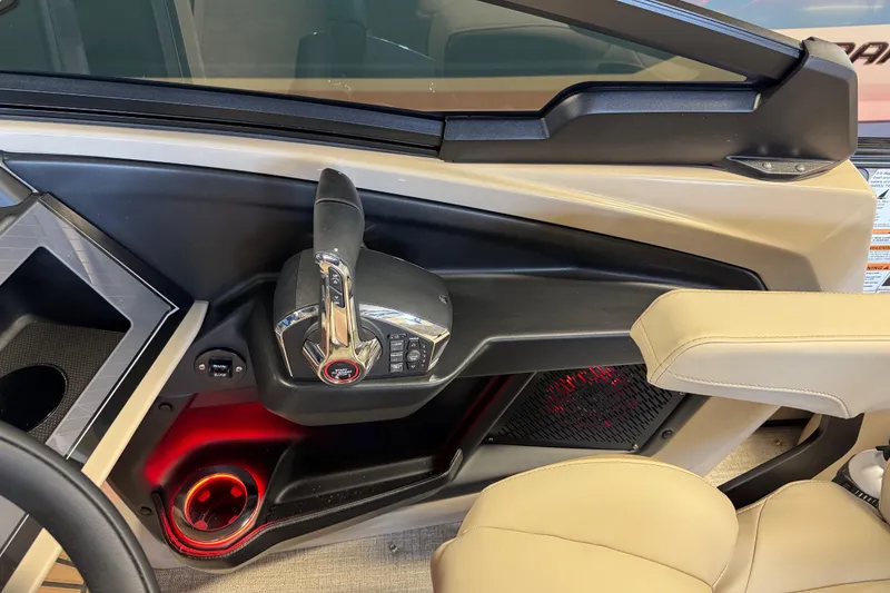 Slide: The Image of 2026 Tahoe Pontoon Grand Tahoe LTD Quad Lounge helm with modern controls and ambient lighting. - 11