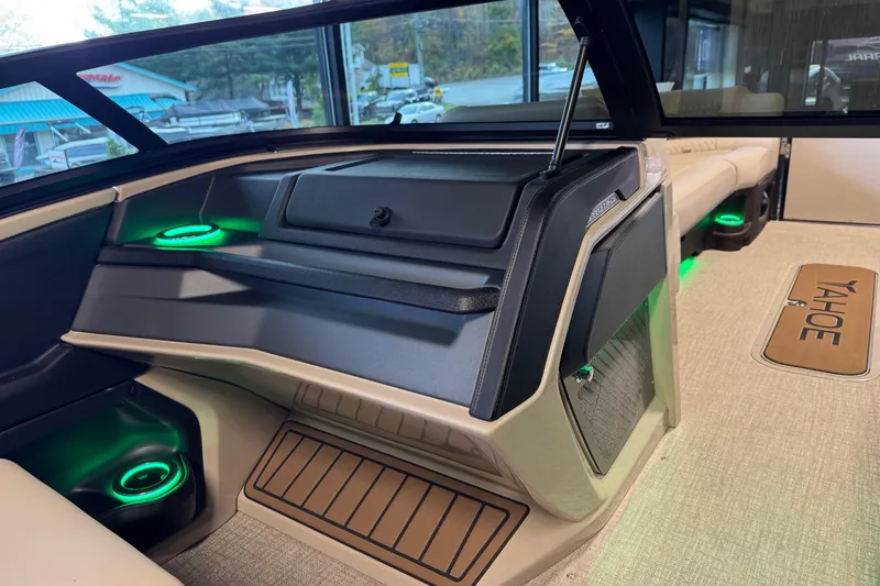 Slide: The Image of 2026 Tahoe Pontoon Grand Tahoe LTD Quad Lounge interior with ambient lighting and luxurious seating. - 12