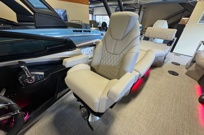 Slide: The Image of 2026 Tahoe Pontoon Grand Tahoe LTD Quad Lounge interior with luxurious seating and modern design. - 16