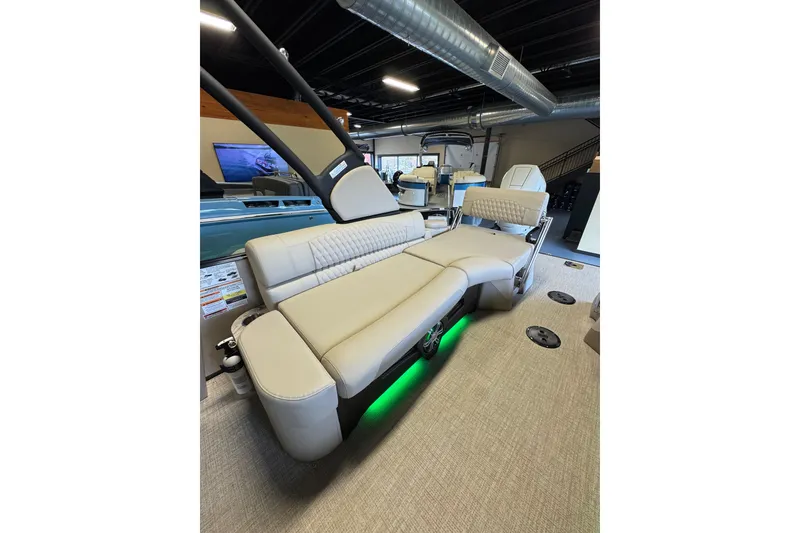 Slide: The Image of 2026 Tahoe Pontoon Grand Tahoe LTD Quad Lounge with luxurious seating and ambient lighting. - 18