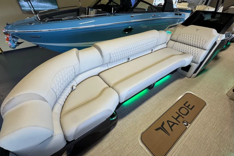 Slide: The Image of Luxurious interior of 2026 Tahoe Pontoon Grand Tahoe LTD Quad Lounge with elegant seating. - 5