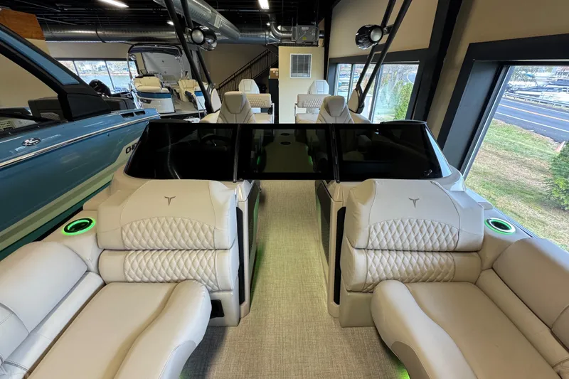 Slide: The Image of 2026 Tahoe Pontoon Grand Tahoe LTD Quad Lounge interior with luxurious seating and modern design. - 9