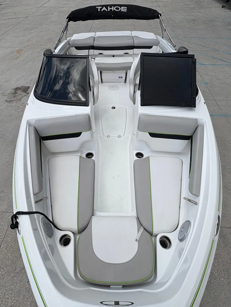 Slide: The Image of 2019 Tahoe 700 boat interior with white and gray seating, black accents, and open deck layout. - 5