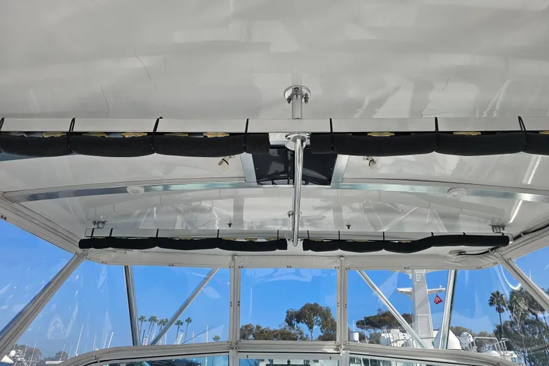 Slide: The Image of Interior view of a 2003 Topaz 32 Express boat with rod holders. - 21