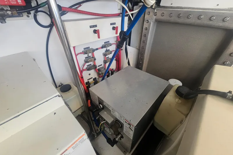 Slide: The Image of Electrical panel and components inside a 2003 Topaz 32 Express boat. - 37