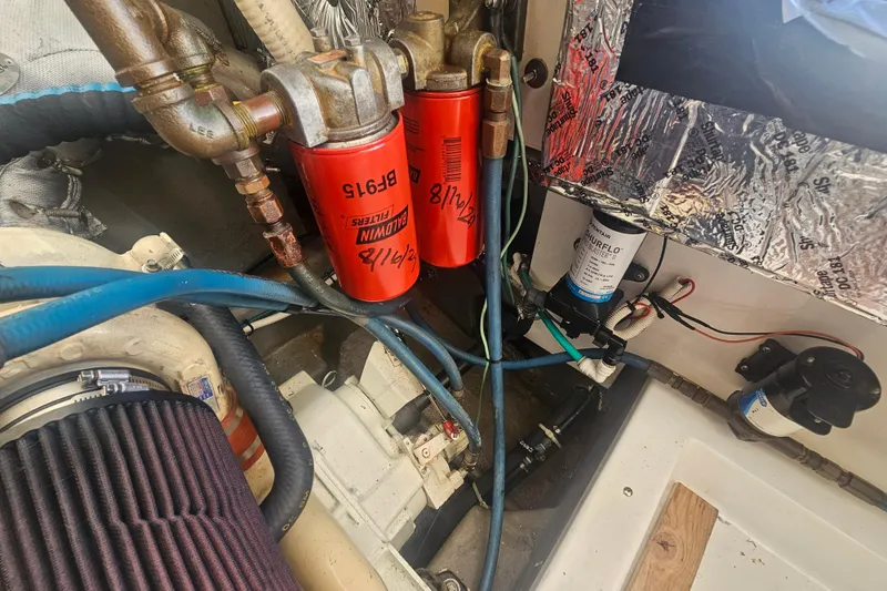 Slide: The Image of Engine compartment of 2003 Topaz 32 Express with Baldwin filters and wiring. - 38