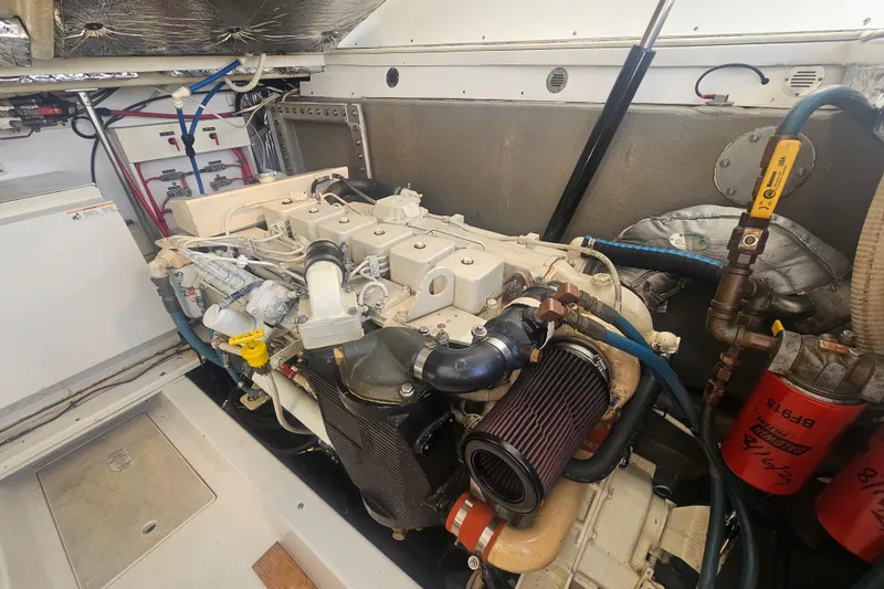 Slide: The Image of Engine room of a 2003 Topaz 32 Express boat, showcasing detailed machinery. - 40