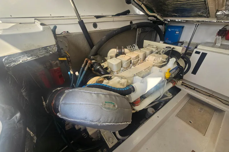 Slide: The Image of Engine room of 2003 Topaz 32 Express boat, showcasing detailed mechanical components. - 41