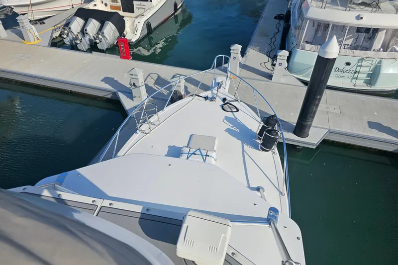 Slide: The Image of 2003 Topaz 32 Express yacht docked at marina, viewed from above. - 6
