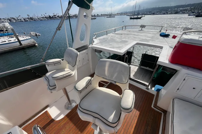 Slide: The Image of 1984 Tung Hwa Princess Aft Cabin yacht with spacious deck and seating, docked in marina. - 10