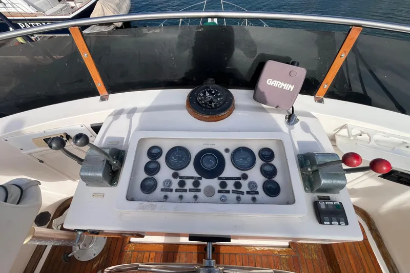 Slide: The Image of 1984 Tung Hwa Princess Aft Cabin helm with Garmin navigation and control panel. - 12