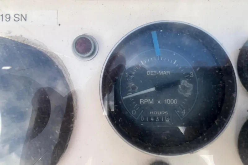 Slide: The Image of Close-up of a 1984 Tung Hwa Princess Aft Cabin RPM gauge showing 14318 hours. - 13