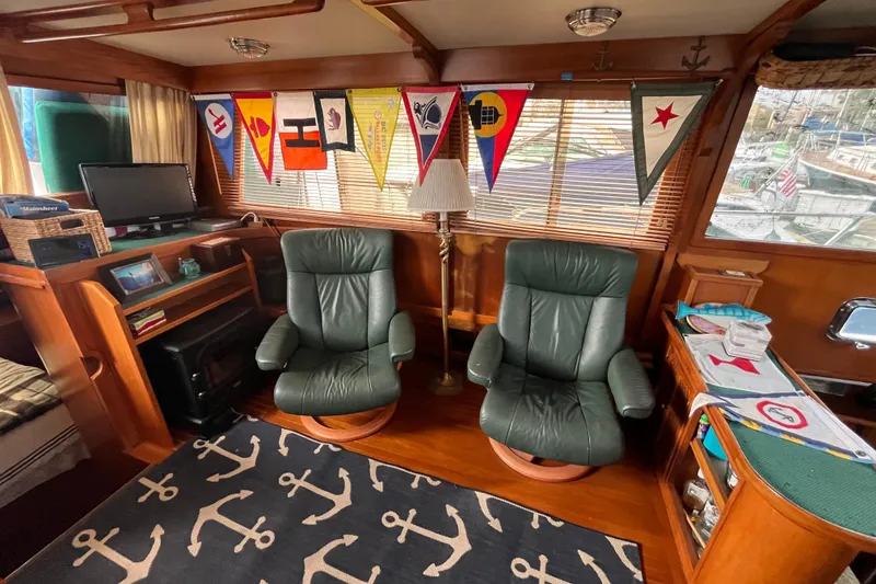 Slide: The Image of 1984 Tung Hwa Princess Aft Cabin interior with leather chairs and nautical decor. - 18