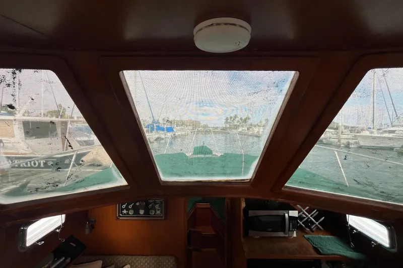Slide: The Image of Interior view of 1984 Tung Hwa Princess Aft Cabin yacht with marina backdrop. - 19