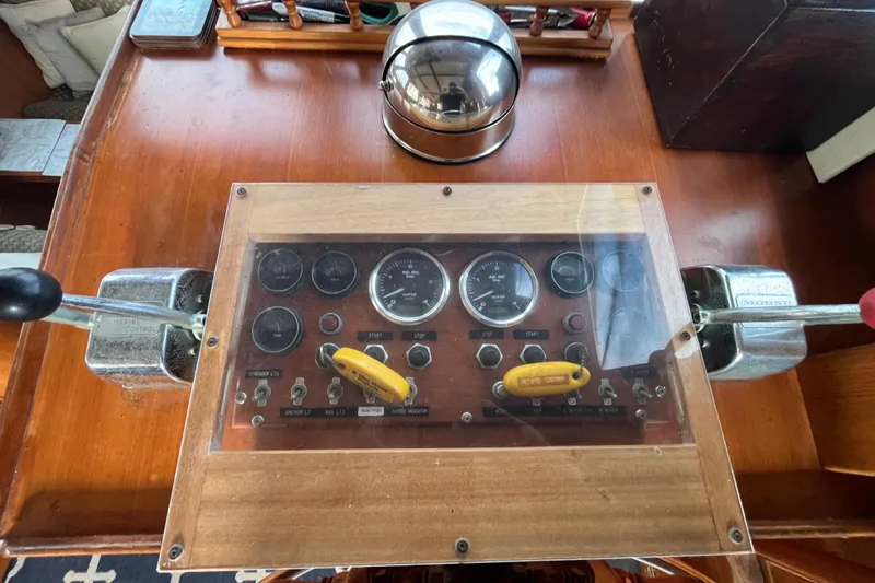 Slide: The Image of 1984 Tung Hwa Princess Aft Cabin boat control panel with gauges and levers. - 21