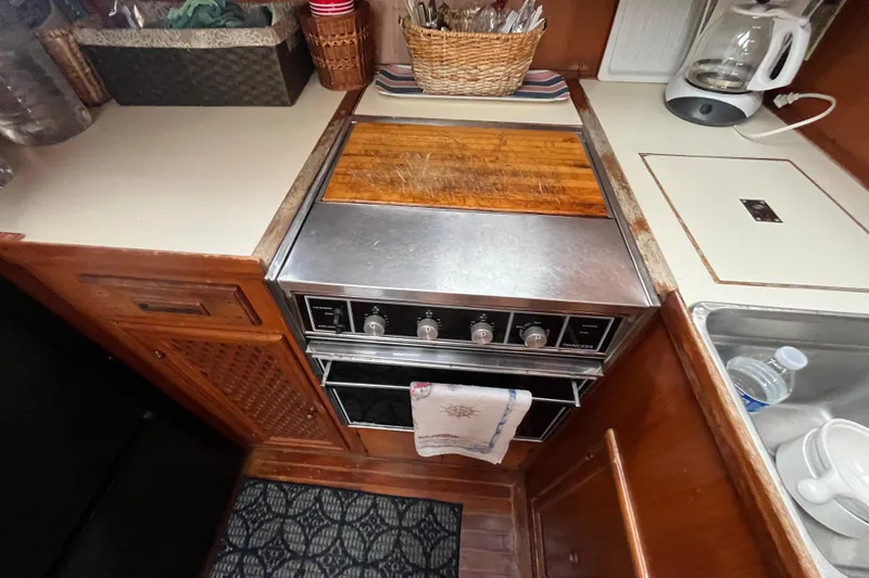 Slide: The Image of 1984 Tung Hwa Princess Aft Cabin kitchen with stove, cutting board, and sink. - 29