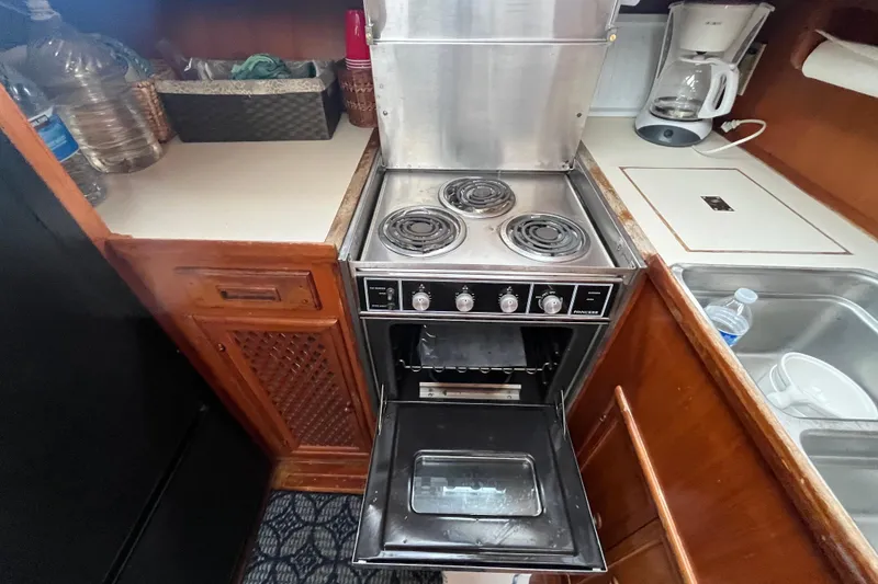 Slide: The Image of 1984 Tung Hwa Princess Aft Cabin kitchen with stove, oven, and countertop appliances. - 30