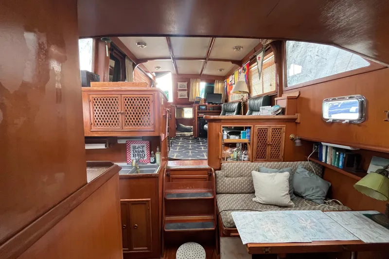 Slide: The Image of 1984 Tung Hwa Princess Aft Cabin interior with wood finish and cozy seating area. - 31