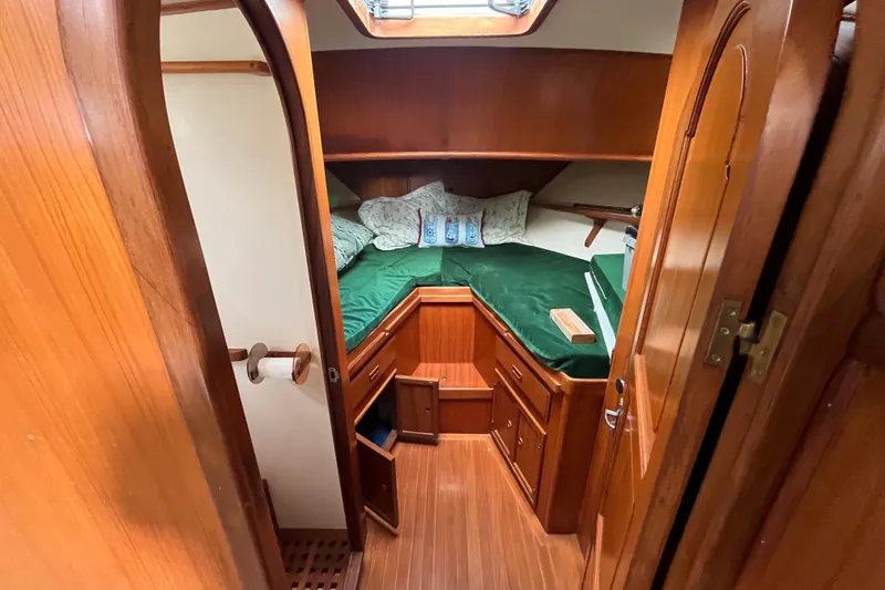 Slide: The Image of 1984 Tung Hwa Princess Aft Cabin interior with wooden finish and cozy bed. - 32