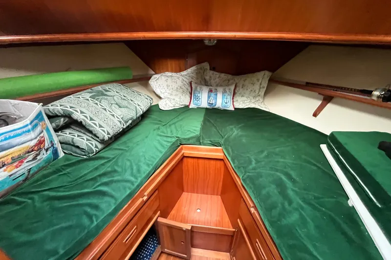 Slide: The Image of 1984 Tung Hwa Princess Aft Cabin interior with green bedding and wooden cabinetry. - 33