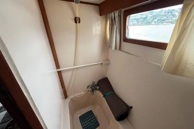 Slide: The Image of 1984 Tung Hwa Princess Aft Cabin bathroom with window view and shower setup. - 41