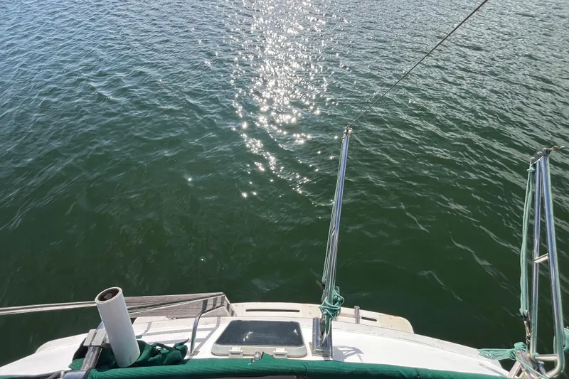 Slide: The Image of 1984 Tung Hwa Princess Aft Cabin yacht on shimmering water, viewed from the deck. - 6