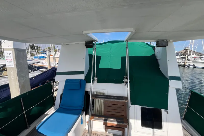 Slide: The Image of 1984 Tung Hwa Princess Aft Cabin yacht with green canopy and blue lounge chair. - 8