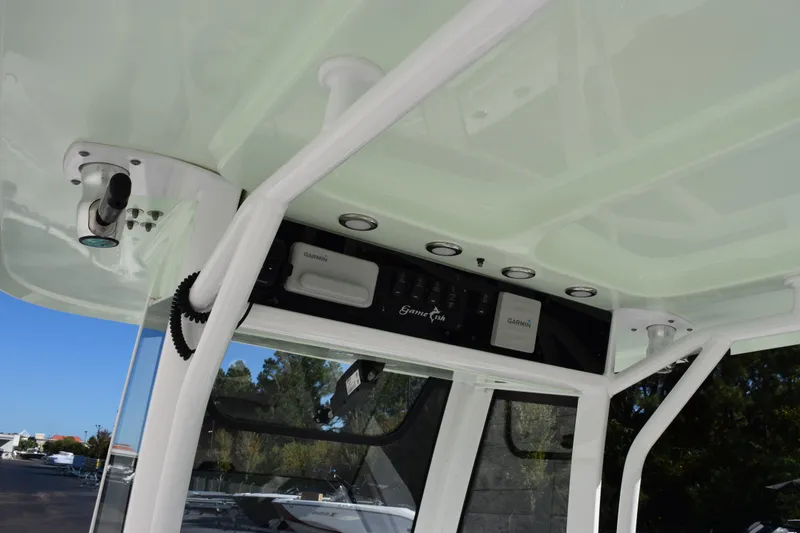 Slide: The Image of 2020 Sea Hunt Gamefish 27 helm with Garmin electronics and overhead lighting. - 11