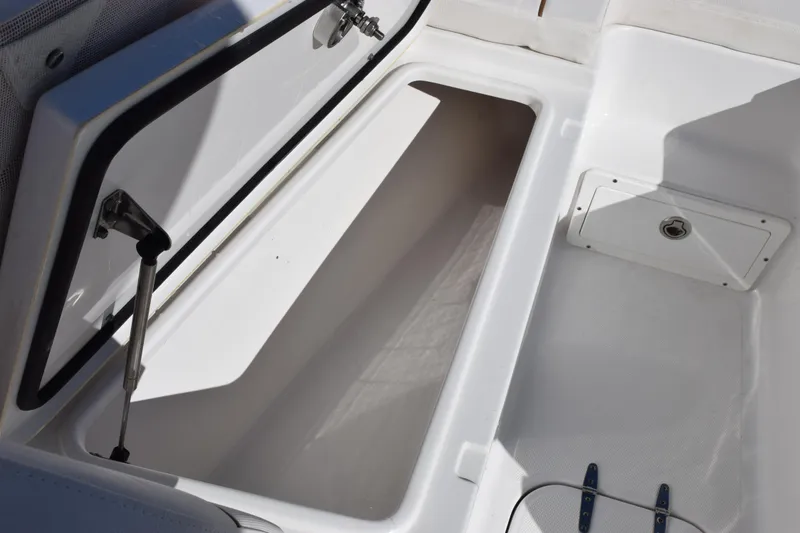 Slide: The Image of 2020 Sea Hunt Gamefish 27 Forward Seating storage compartment open. - 17