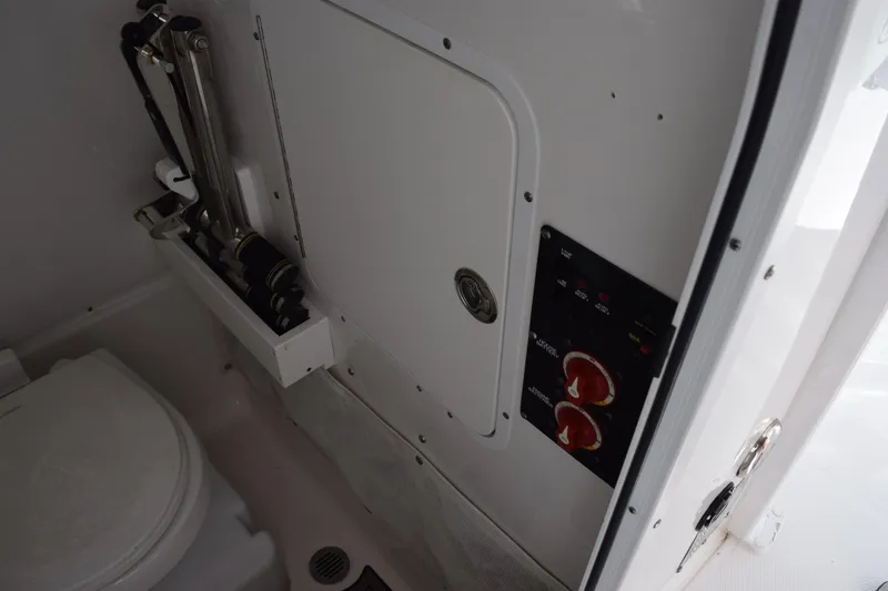 Slide: The Image of 2020 Sea Hunt Gamefish 27 Forward Seating interior with control panel and storage. - 20