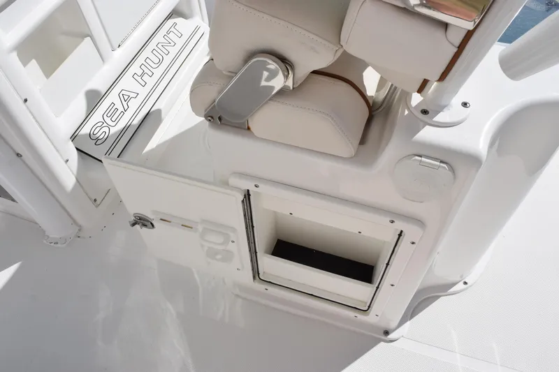 Slide: The Image of 2020 Sea Hunt Gamefish 27 boat interior with storage compartment and seating. - 21