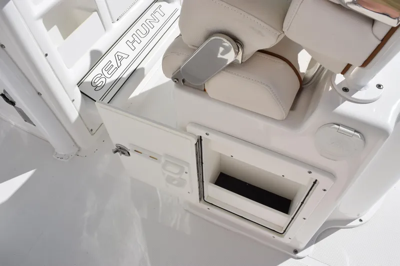 Slide: The Image of 2020 Sea Hunt Gamefish 27 Forward Seating interior with storage compartment and seating detail. - 22