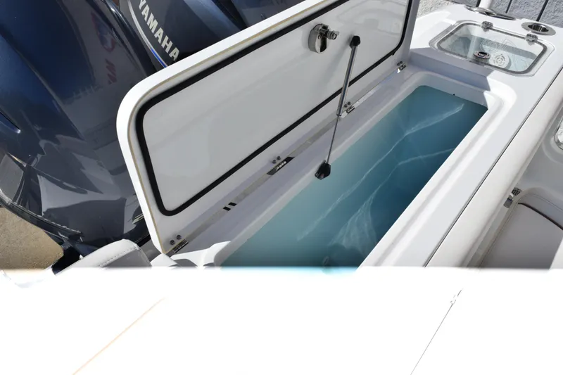 Slide: The Image of 2020 Sea Hunt Gamefish 27 Forward Seating boat with open storage compartment. - 26