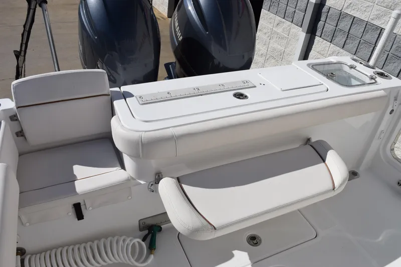 Slide: The Image of 2020 Sea Hunt Gamefish 27 boat interior with seating and dual engines. - 8