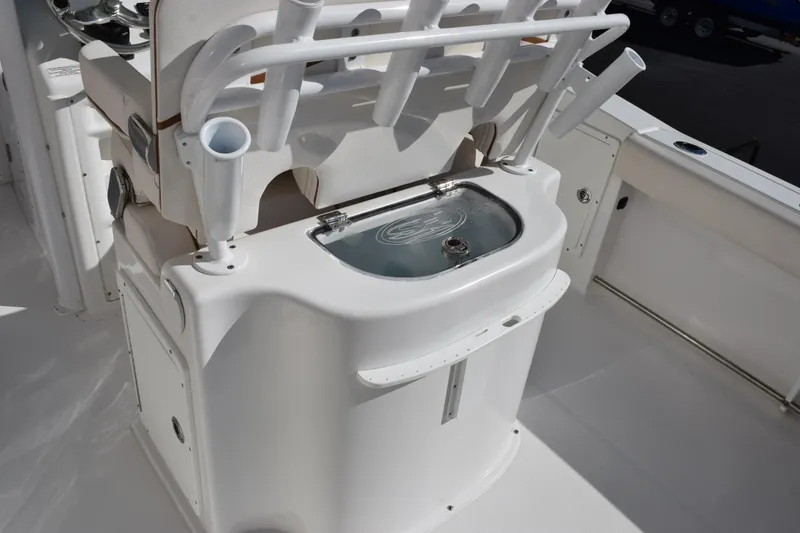 Slide: The Image of 2020 Sea Hunt Gamefish 27 boat interior with rod holders and livewell. - 9