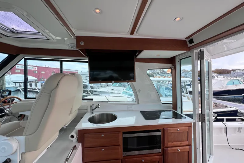 Slide: The Image of Interior of 2024 Back Cove 39O yacht with modern kitchen and helm station. - 26