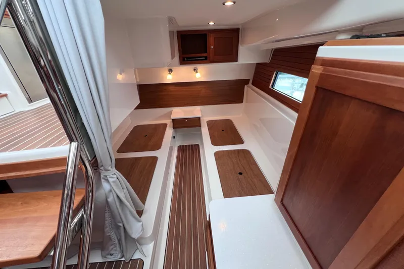 Slide: The Image of 2024 Back Cove 39O interior with wood accents and modern lighting. - 38