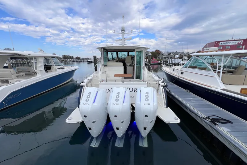 Slide: The Image of 2024 Back Cove 39O boat with triple 400 V10 engines docked at marina. - 8