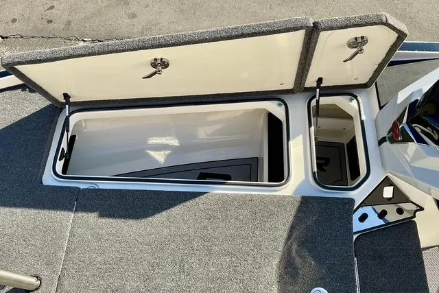 Slide: The Image of 2023 Ranger Z520R boat storage compartments open, showcasing spacious interior design. - 11