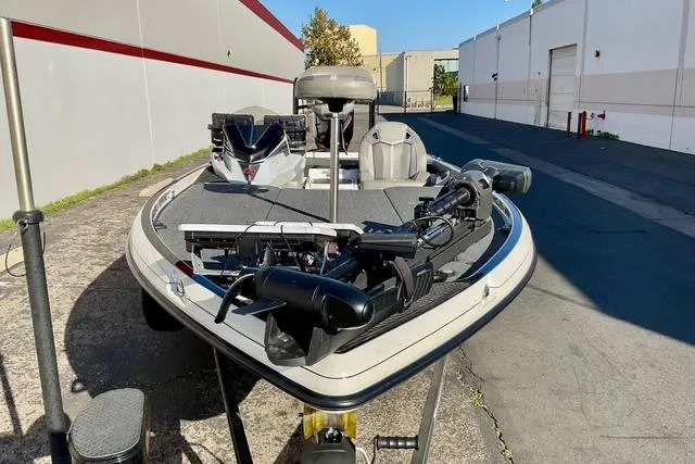 Slide: The Image of 2023 Ranger Z520R Ranger Cup Equipped boat parked outdoors, showcasing advanced fishing gear. - 19