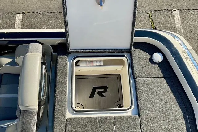 Slide: The Image of 2023 Ranger Z520R Ranger Cup Equipped boat storage compartment with open lid. - 20
