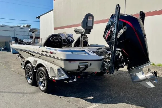Slide: The Image of 2023 Ranger Z520R boat with powerful 250 engine, parked outdoors. - 4