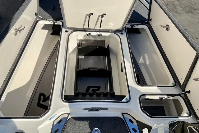 Slide: The Image of 2023 Ranger Z520R Ranger Cup Equipped boat storage compartments open, showcasing spacious design. - 9