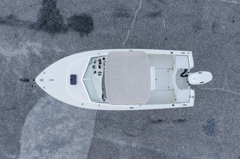 Slide: The Image of Aerial view of 2004 Hoby Pilot 19 boat on asphalt surface. - 10